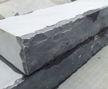 Quy Nhon Basalt Wall bricks, front and back sides cleaved with reworked edges, other sides sawn.
